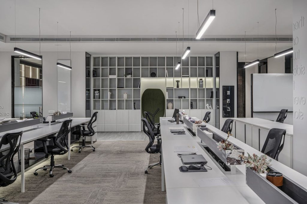 Explore this modern luxury office interior with open workspaces and sleek minimalist design.